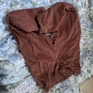 brown corduroy, super cute. super deep front pockets, no back pockets tho.